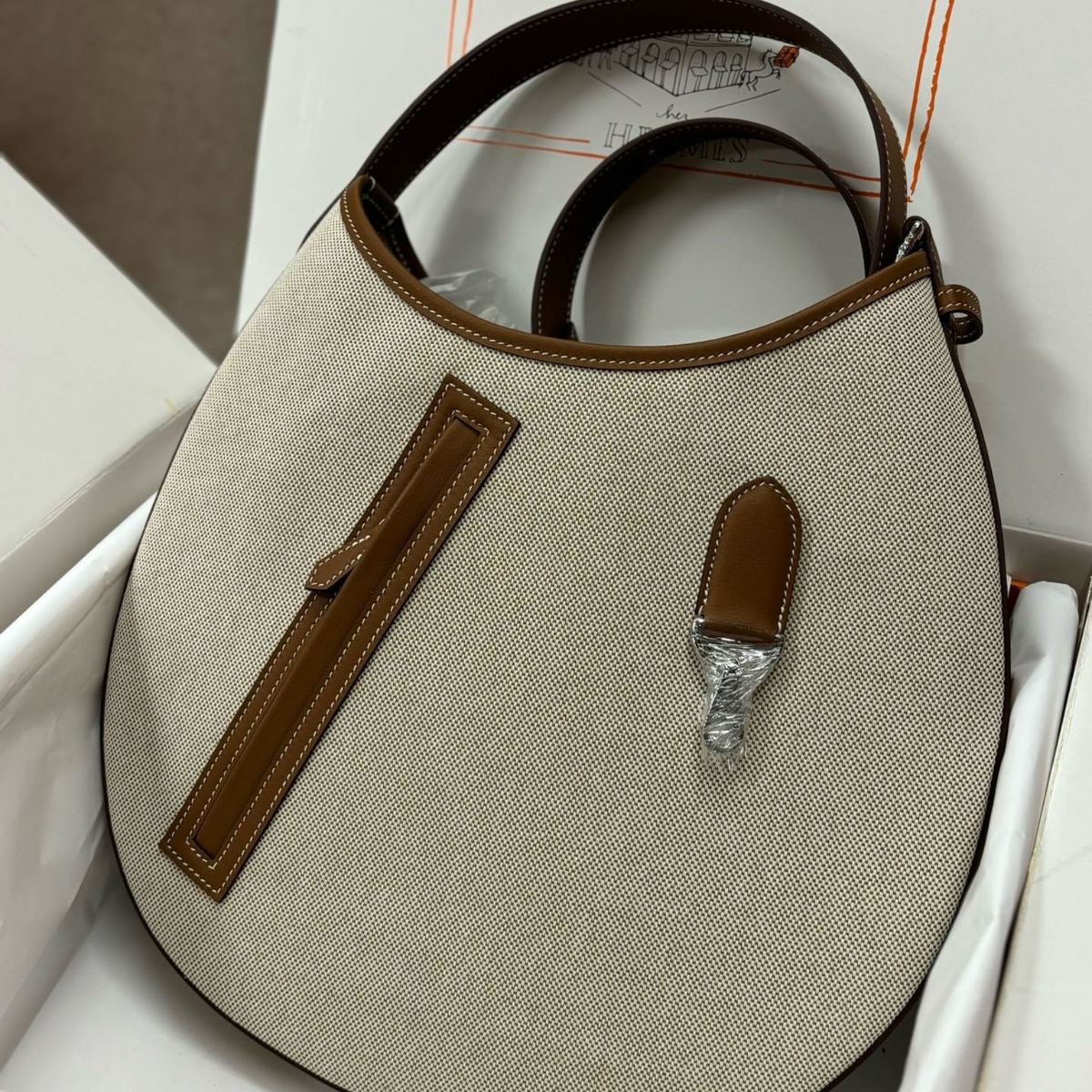 P’TIT ARÇON BAG IN CANVAS & LEATHER HERMÈS